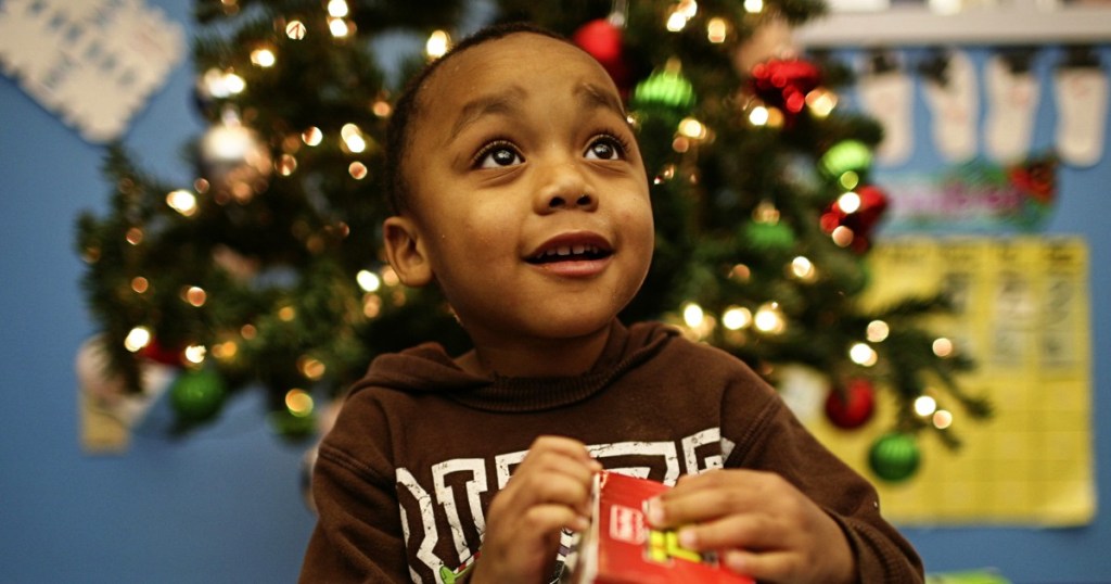 boy opening Christmas gift