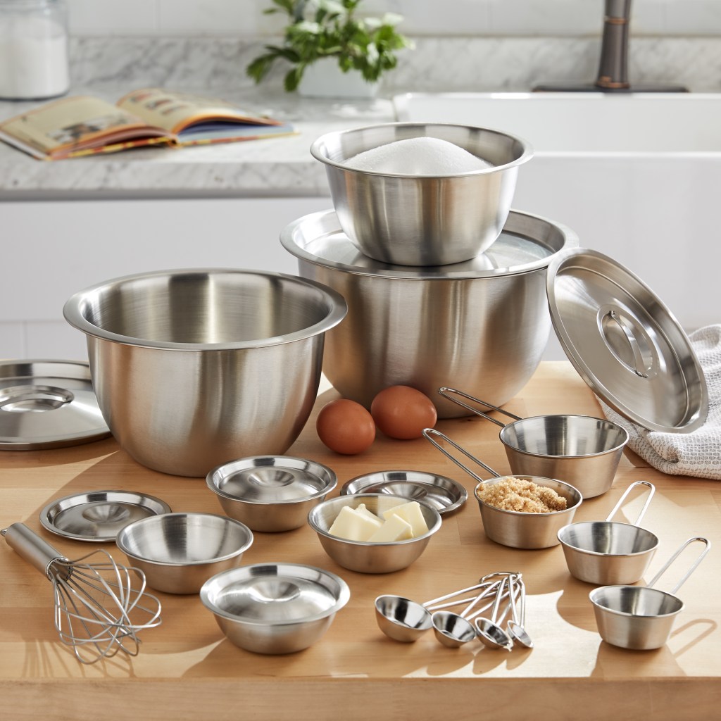 stainless steel mixing bowls on a table