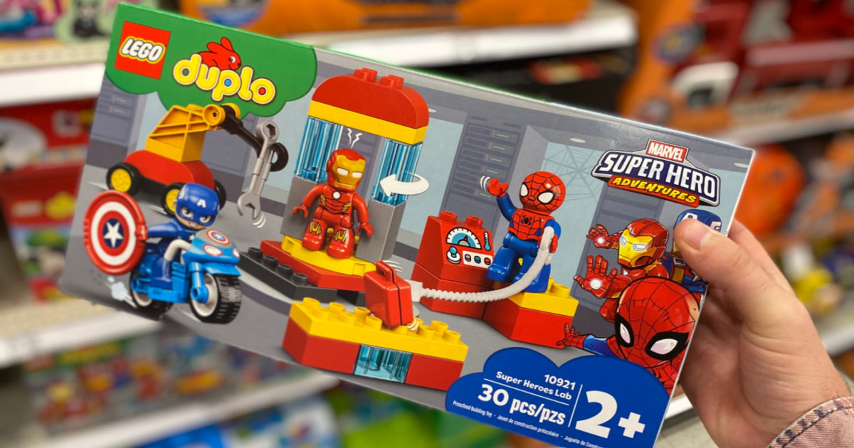 hand holding lego duplo marvel set