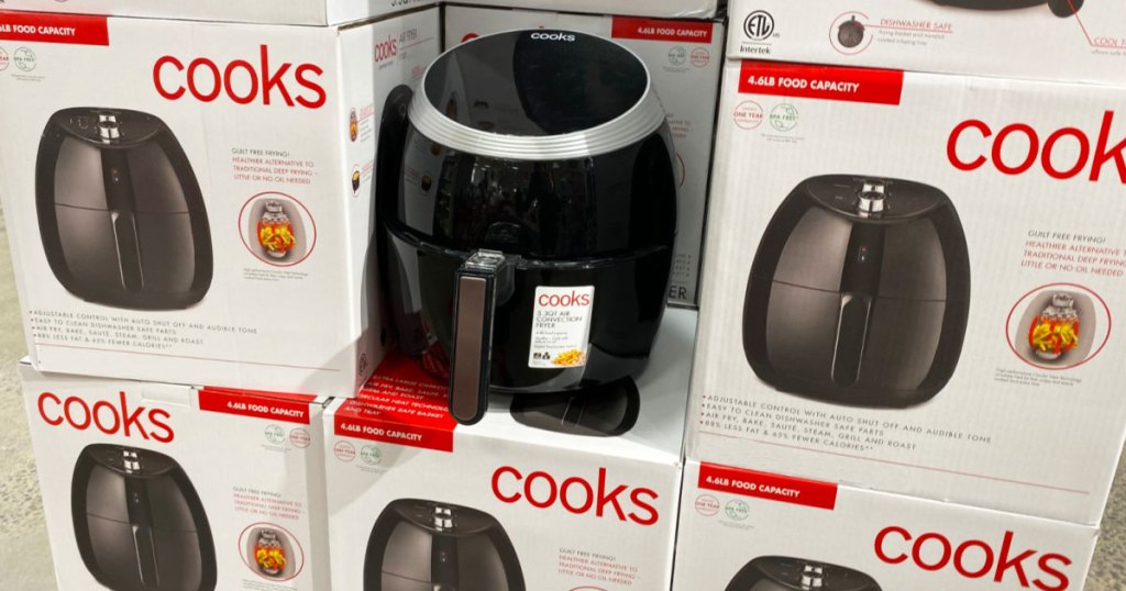 black air fryer on top of white boxes of cooks brand air fryers at JCPenney