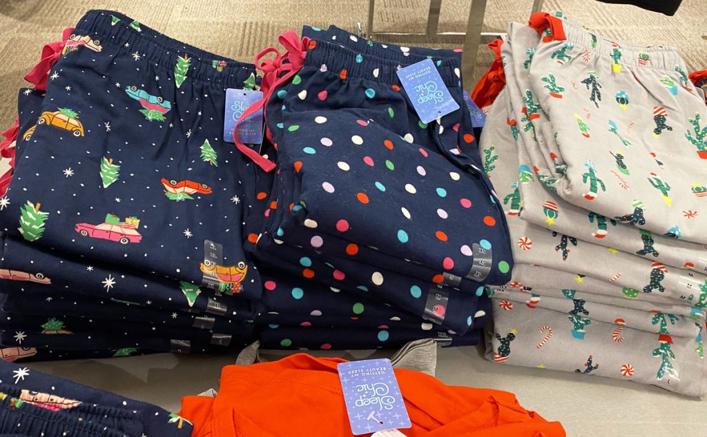 folded stacks of women's holiday print pajama pants at JCPenney