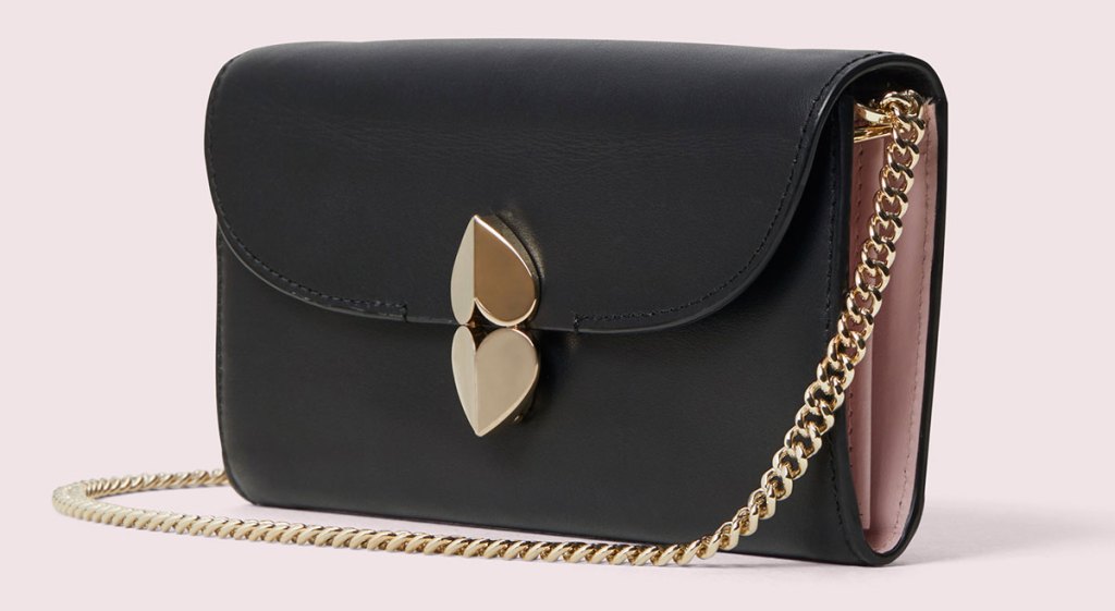 black crossbody bag with gold double heart closure and gold chain strap