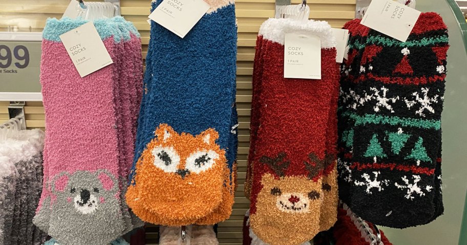 pairs of fuzzy socks with animals at tips of toes hanging on display at kohl's