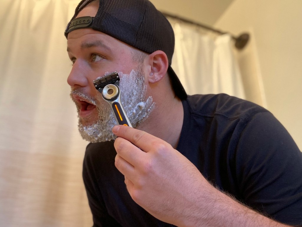 man shaving with gillette heated razor