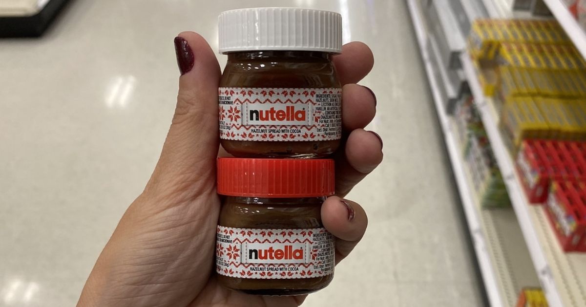 Woman holding two Nutella 1oz Holiday Jar