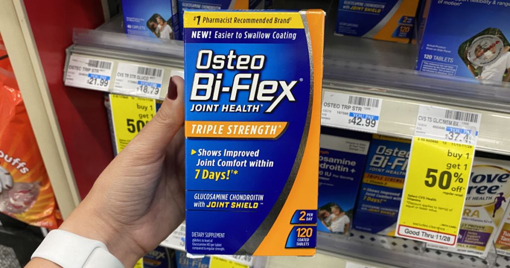 hand holding osteo bi flex in front of shelf