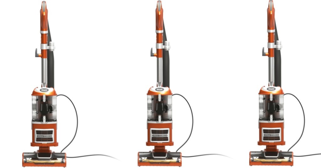 Three gray and orange vacuum cleaners