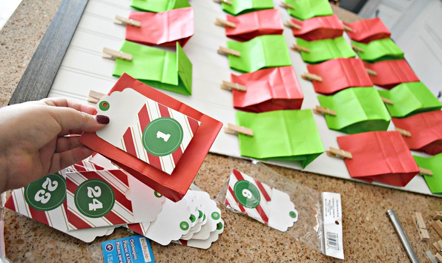 hand holding red bag for diy advent calendar