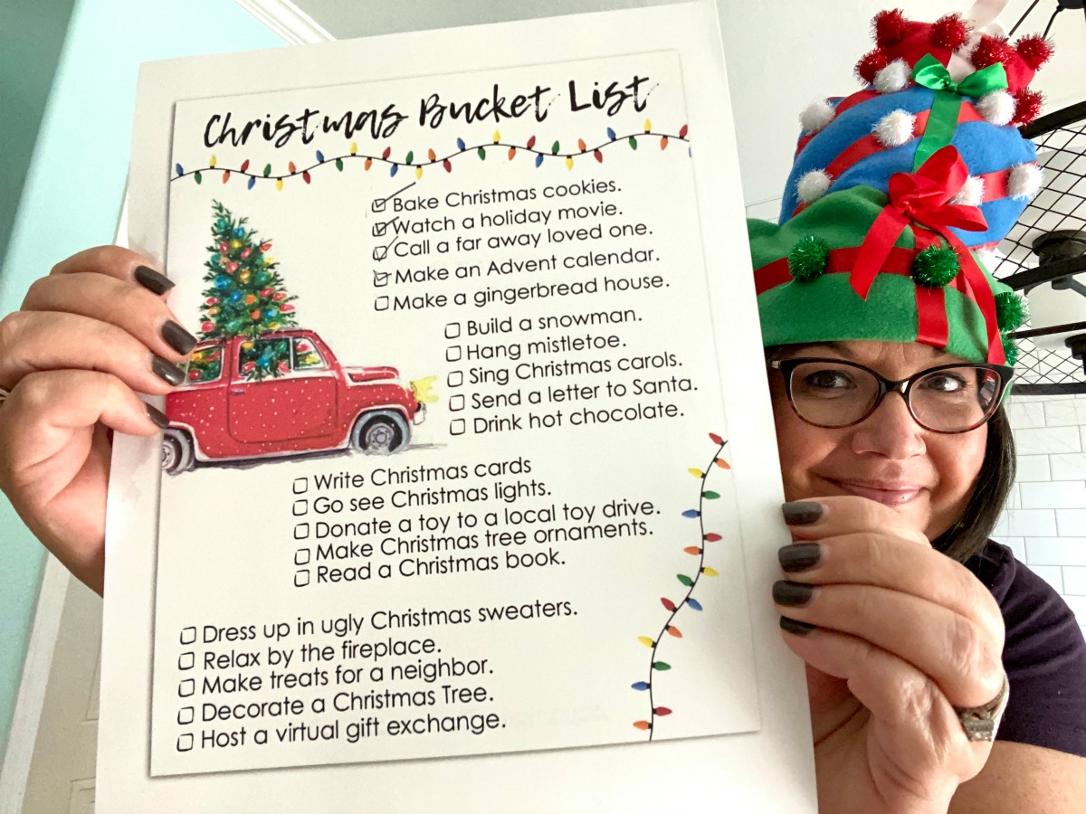 holding up a christmas bucket list