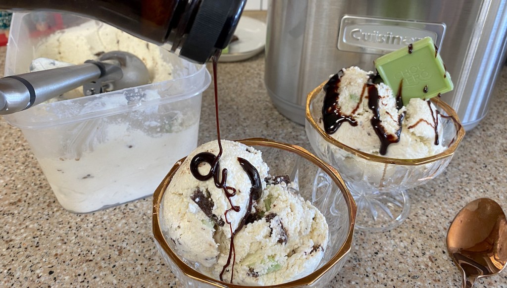 chocolate bottle drizzling on top of bowls of ice cream