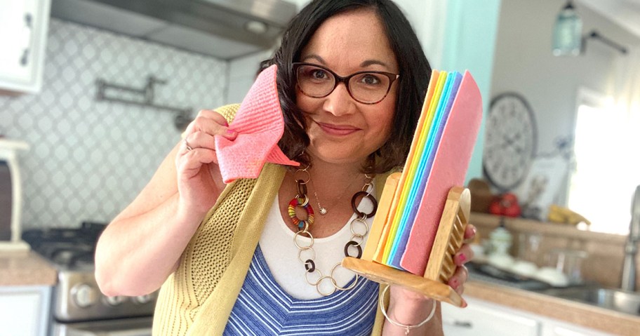 woman holding swedish dish cloths