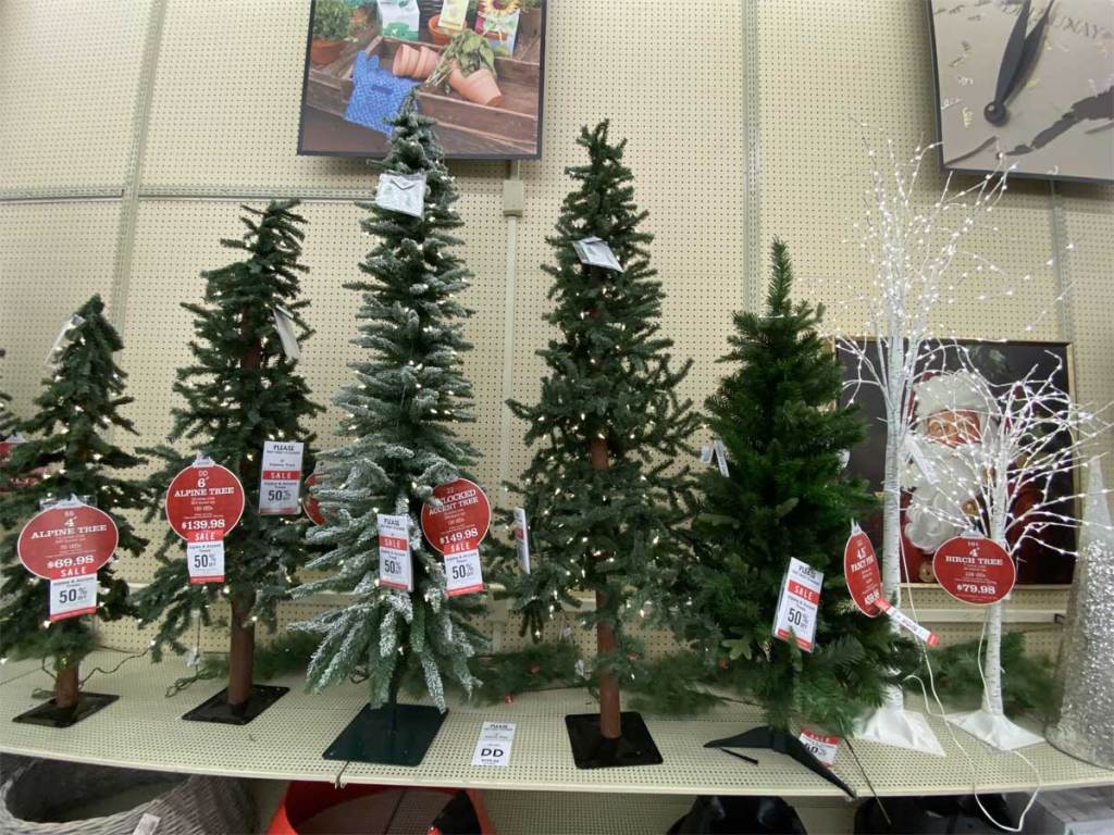 christmas trees on display in a store