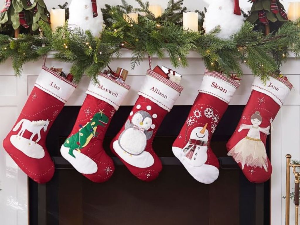 Christmas stockings filled and hanging on mantle