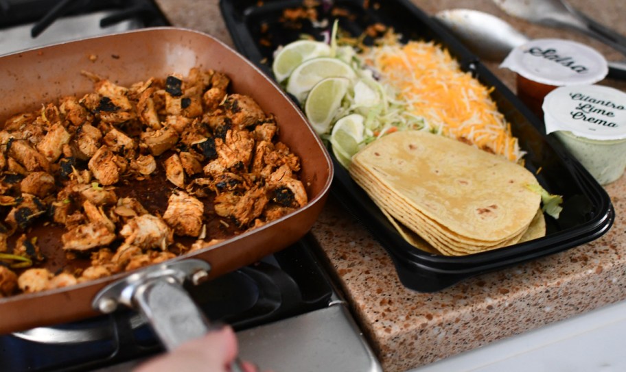 preparing costco street tacos on stove