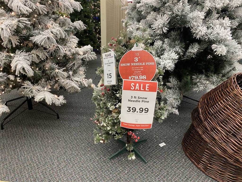 christmas trees on display in a store