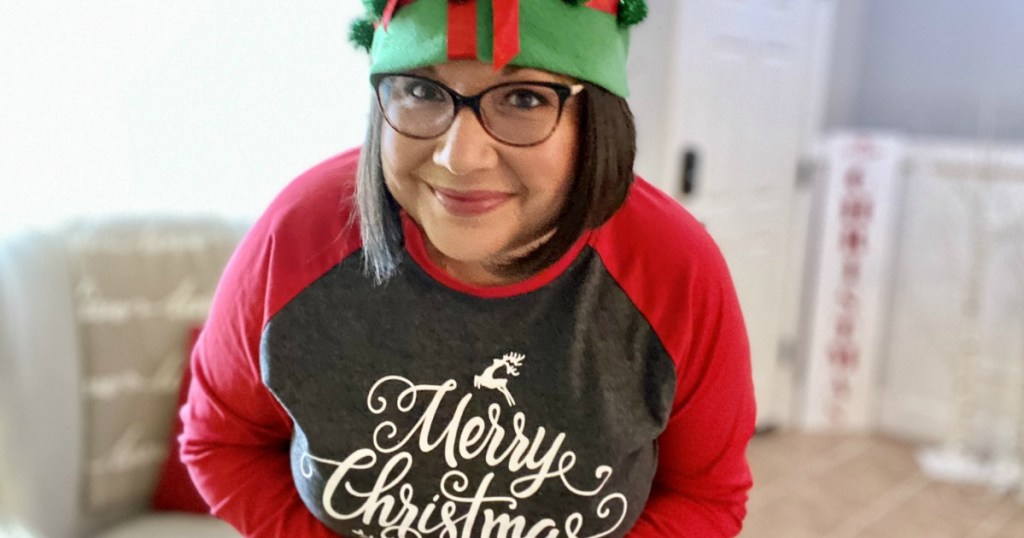 Woman wearing Christmas tee and Christmas hat