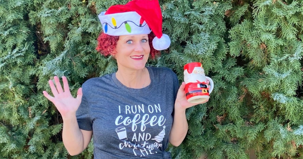 woman wearing Santa hat with festive mug