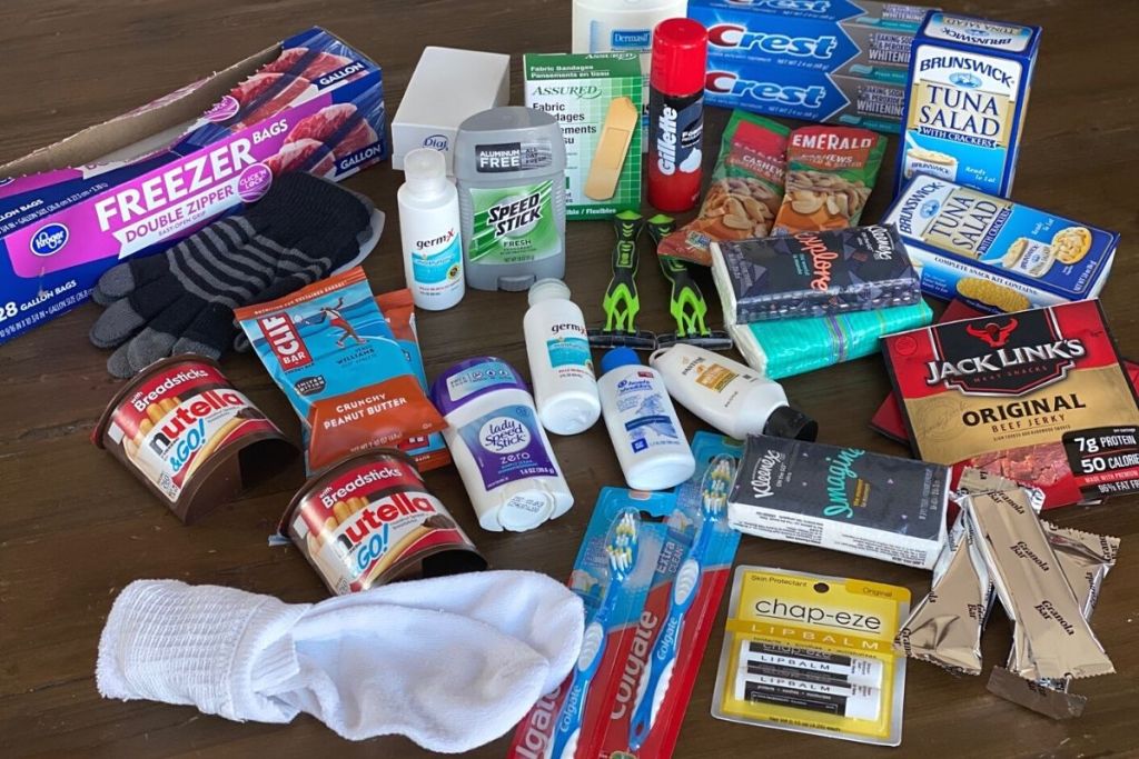 A variety of toiletries, snacks and other items on a table