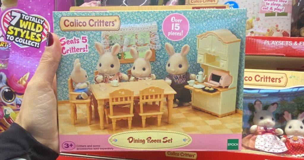 hand holding Calico Critters Dining Room Set