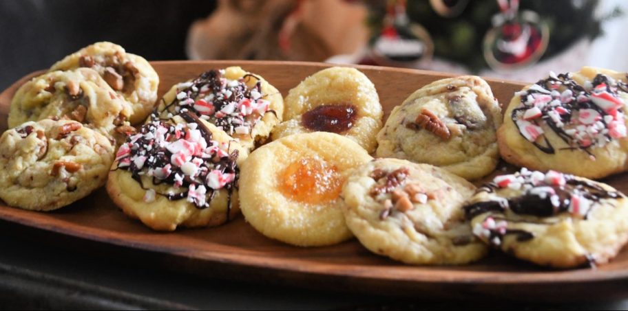 A plate full of various Christmas cookies made from one dough