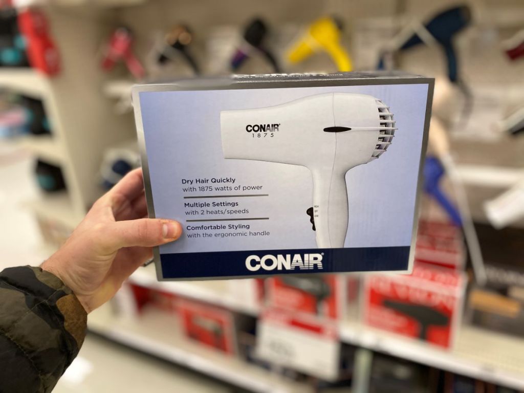 hand holding a Conair hair dryer