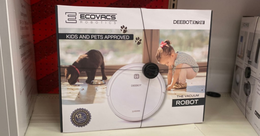 white robot vacuum on shelf