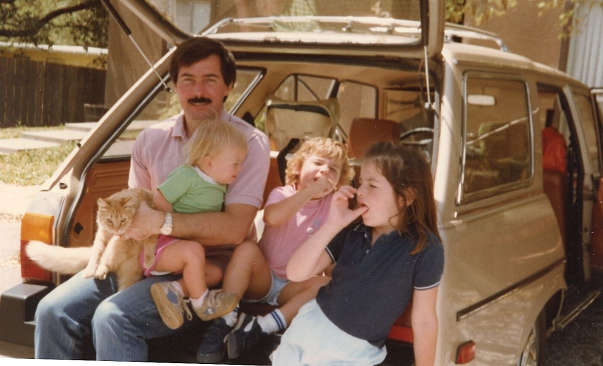 A family next to a car