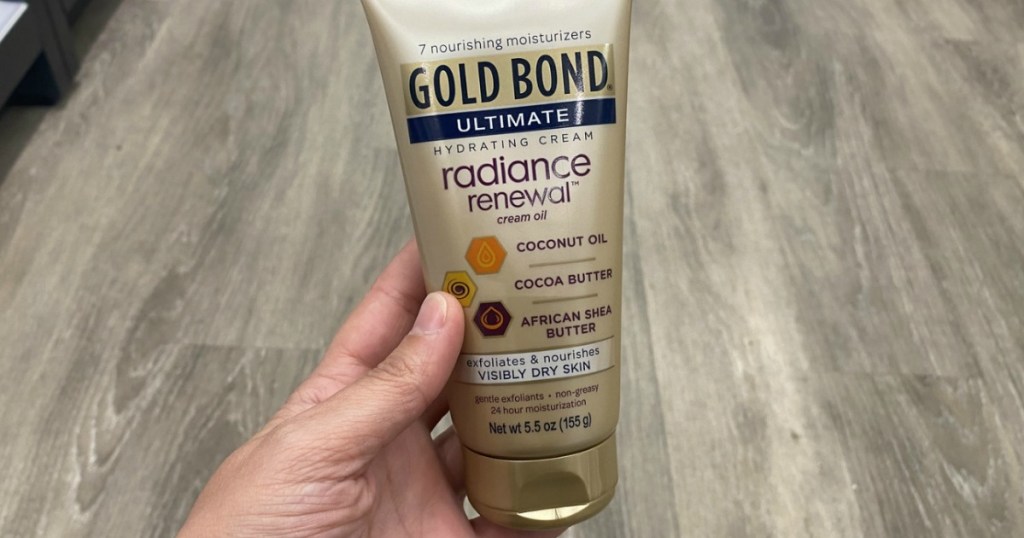 hand holding Gold Bond Ultimate Radiance Renewal Lotion