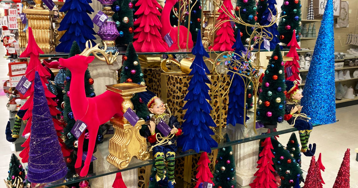 various colors and sizes Christmas trees on display at hobby lobby