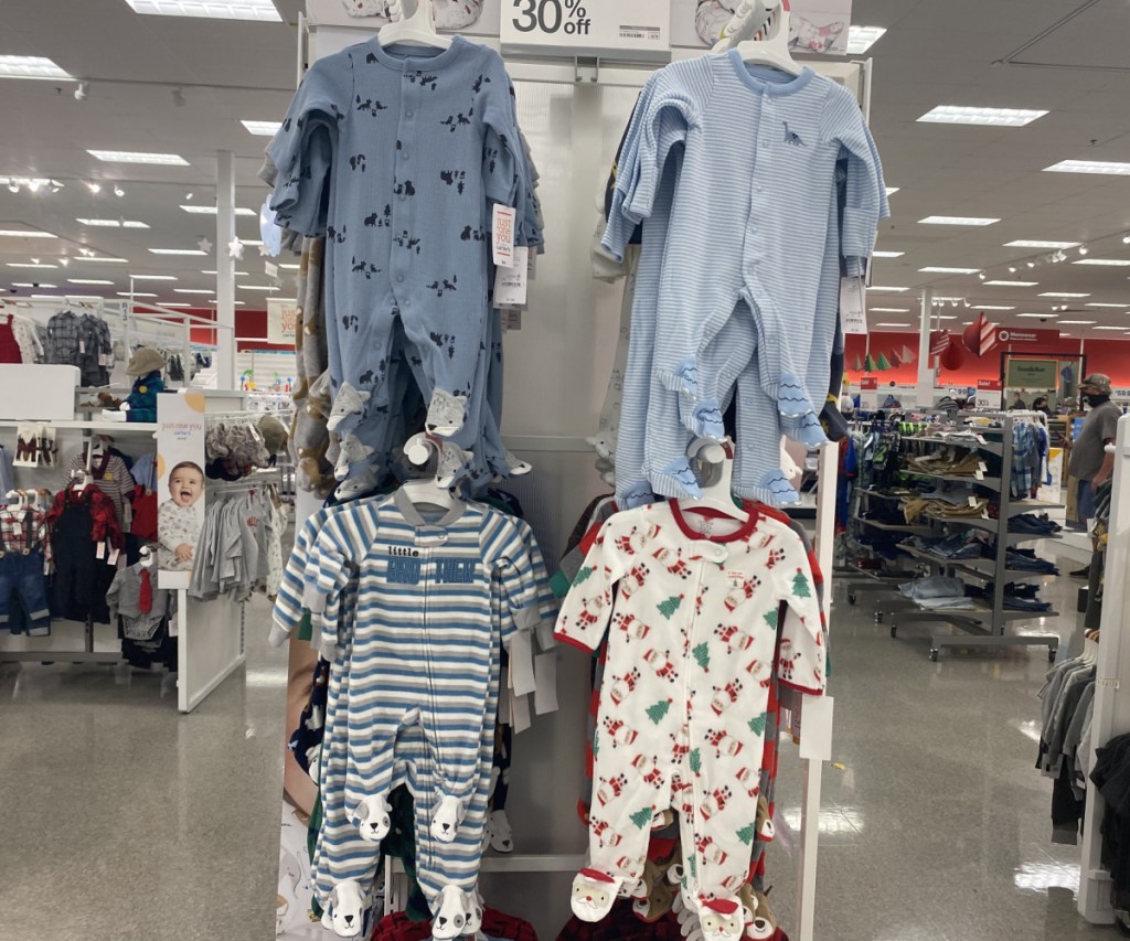 baby sleepwear hanging in store