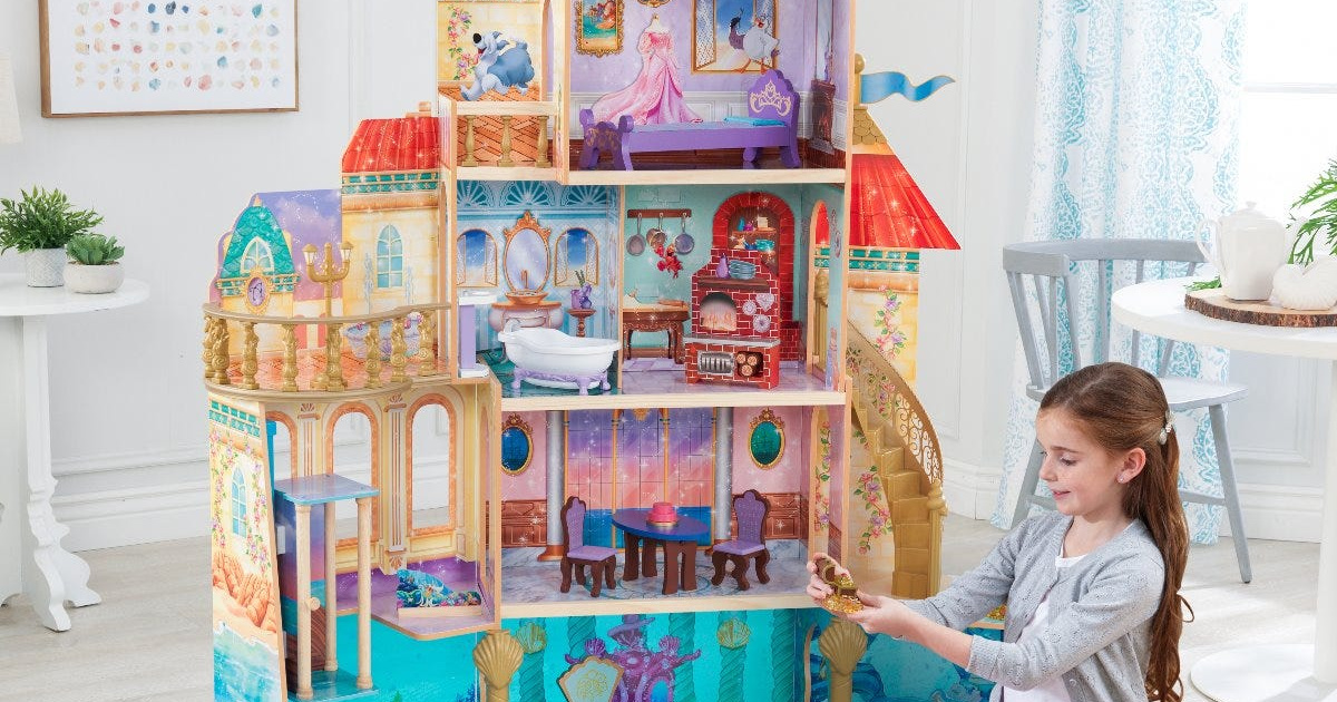 girl playing with Disney Ariel dollhouse