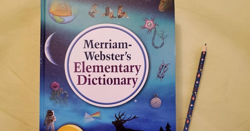 Merriam-Webster's Dictionary on a table with a pencil