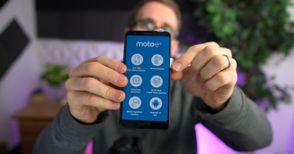 man holding moto e6