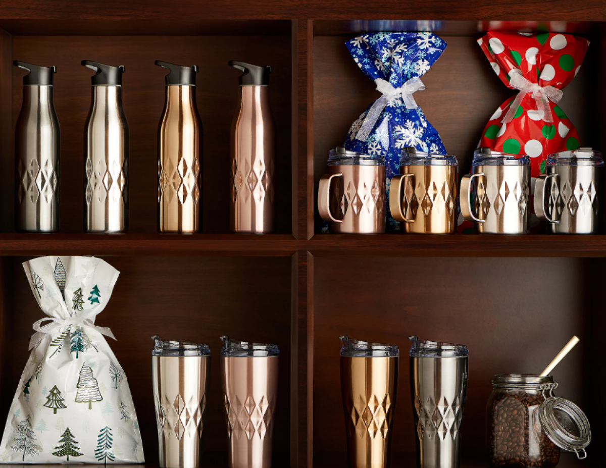 Primula Peak tumblers and gift bags on a shelf