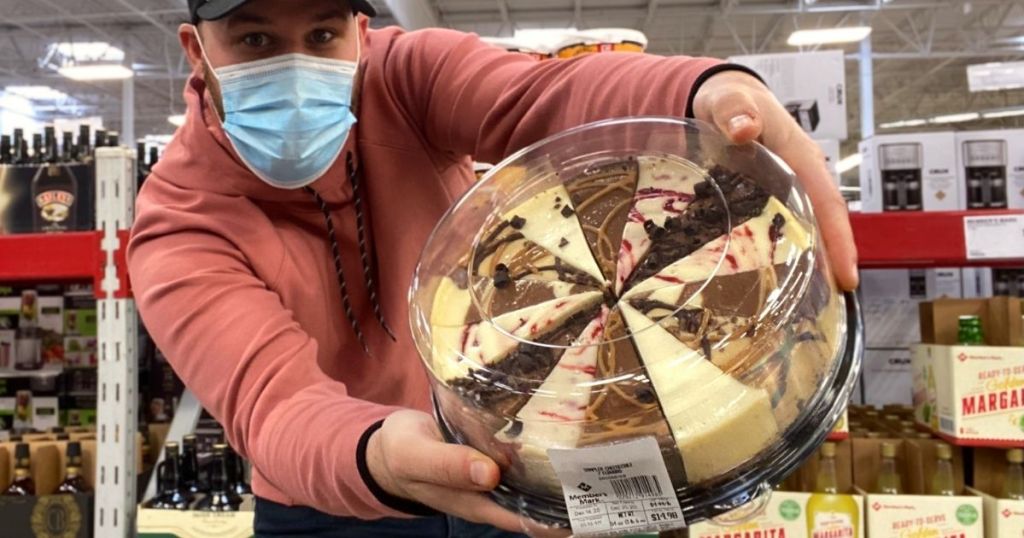 man holding Sam's Club 7-Flavor Cheesecake