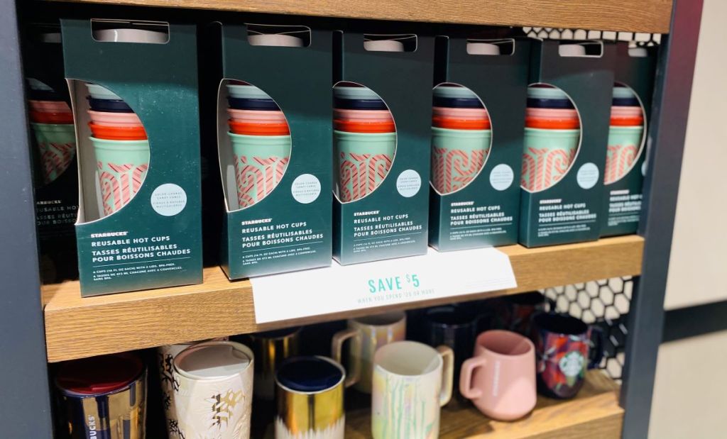 display of Starbucks tumblers on a shelf