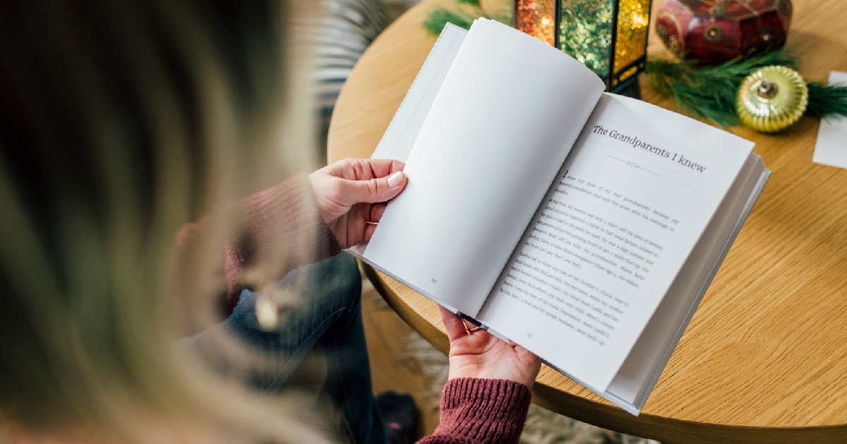 woman reading Storyworth book about her grandparents