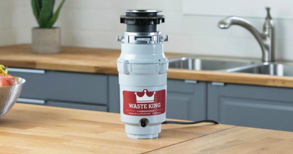 waste king brand garbage disposal sitting on a kitchen countertop