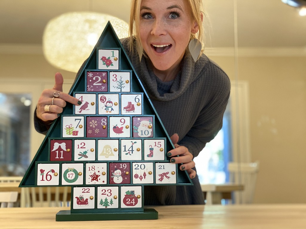 woman with christmas tree advent calendar