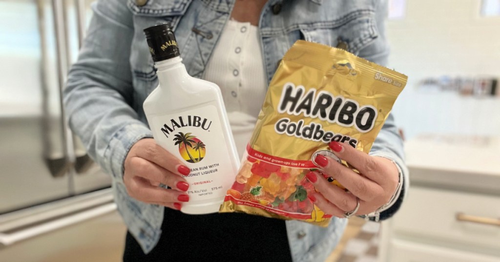 holding gummy bears and rum