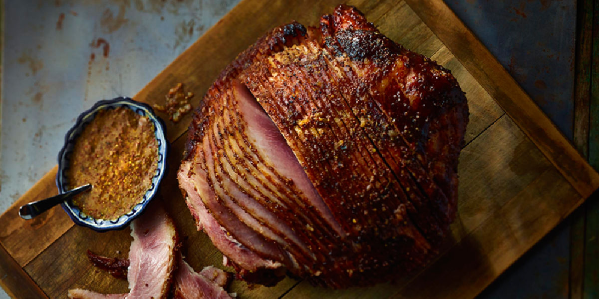 spiral cut ham on wooden cutting board