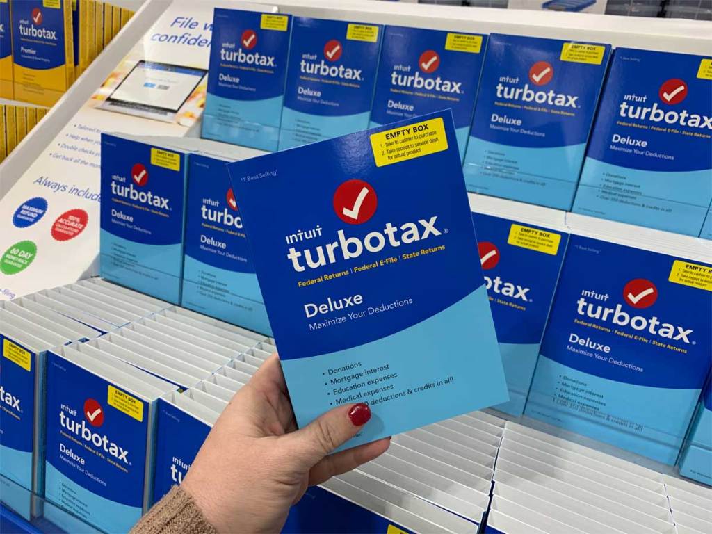 hand holding a turbotax software program in store