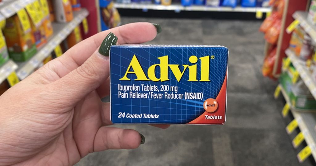 hand holding advil