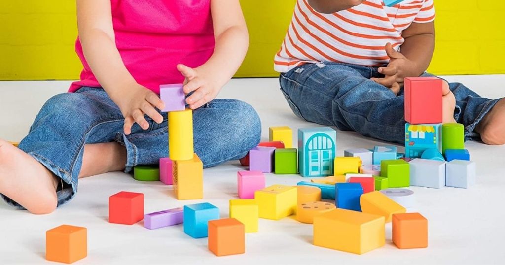 kids playing with Bright Starts Set-The-Scene Sesame Street Wooden Storytelling Blocks