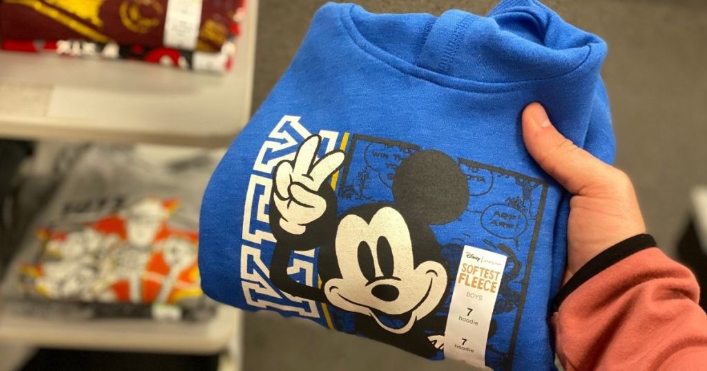 hand holding Disney Jumping Beans Mickey Mouse Hoodie in store