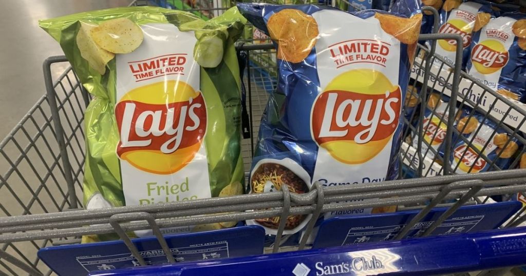 Two bags of Lay's potato chips in front basket of shopping cart