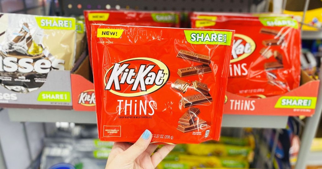 hand holding package of Kit Kat thins