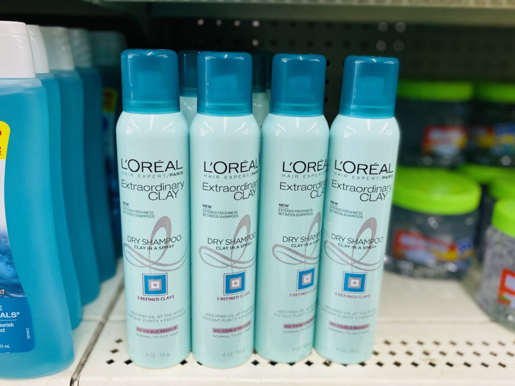 multiple bottles of L'Oreal Paris Elvive Extraordinary Clay Dry Shampoo 4 OZ at dollar tree