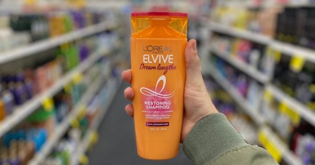 Hand holding Loreal Elvive Shampoo