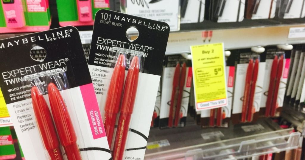 Maybelline Twin Eye & Brow Pencils held up in woman's hand